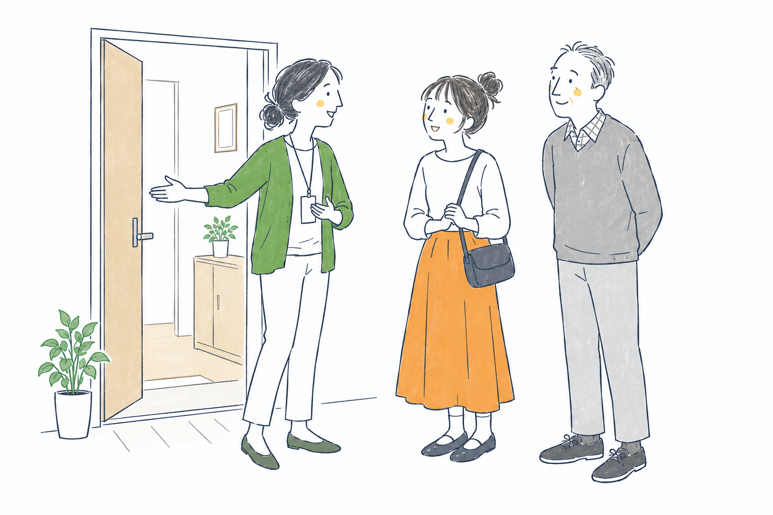 グループホームを見学するご本人とご家族をスタッフが迎える様子